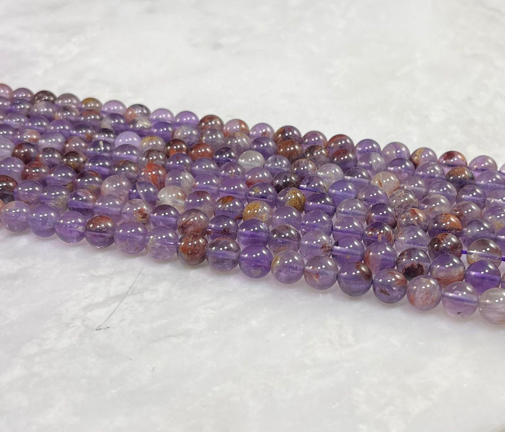 Auralite 23 aka Amethyst w/ Hematite Inclusions Round